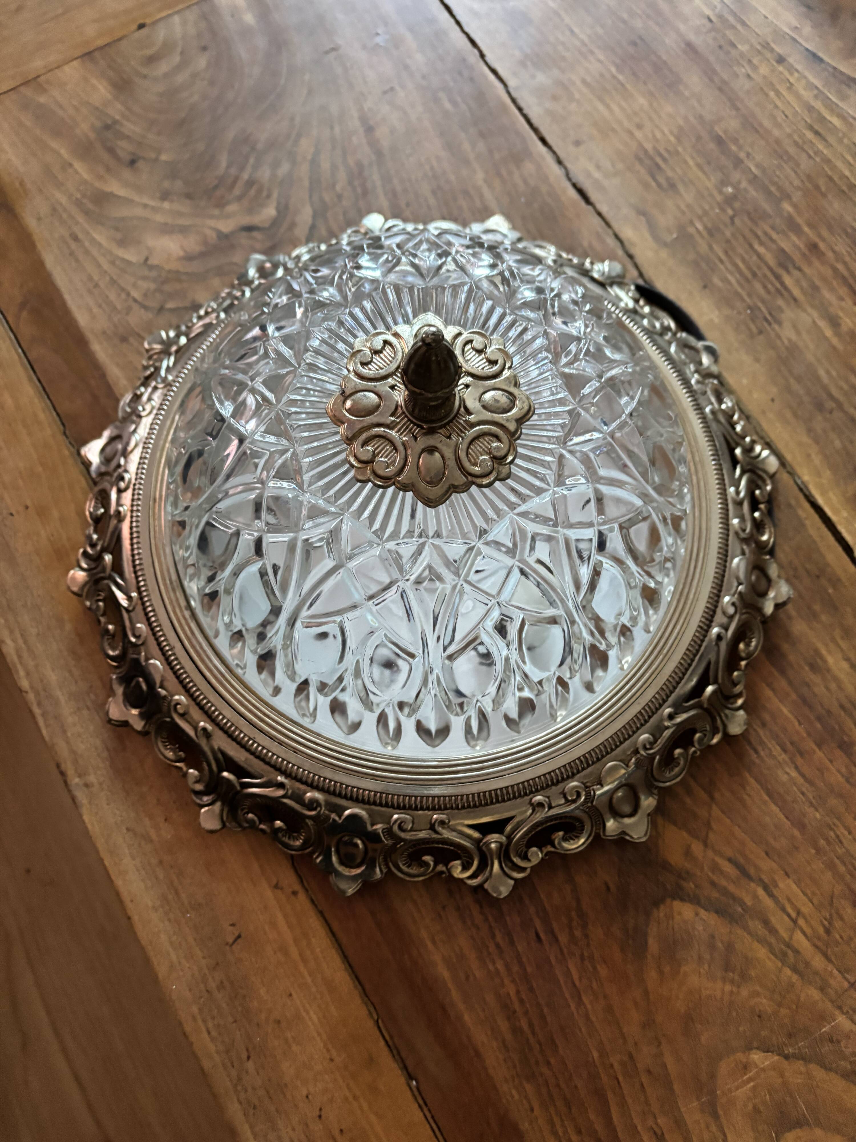 Gold ceiling light with chiseled glass globe