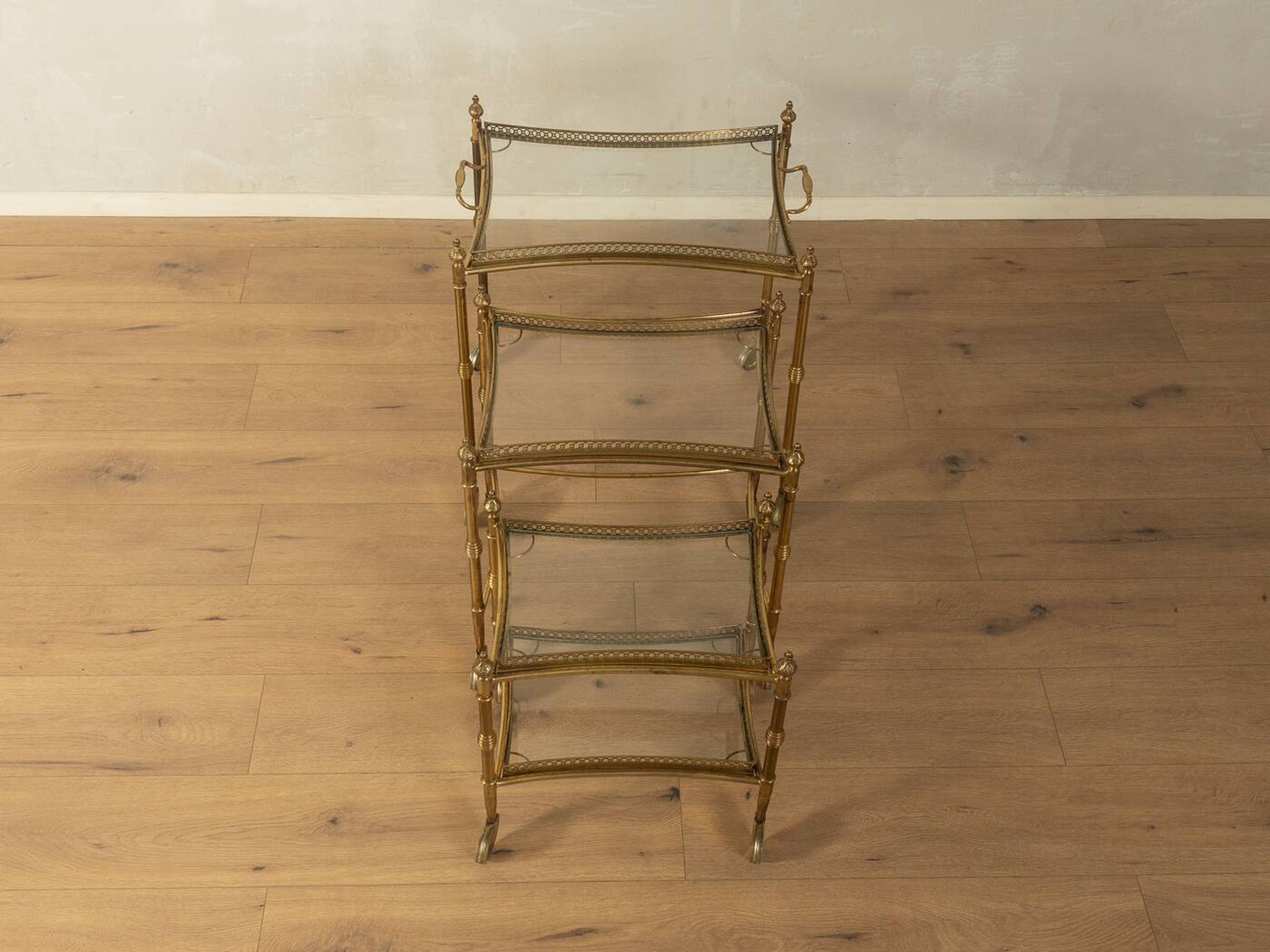 Set of 3 vintage Hollywood Regency nesting tables with brass frame and glass tops (1960s)