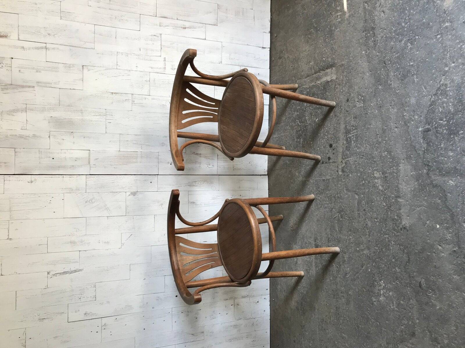 Pair of Thonet bistro chairs in brown wood, bentwood design from the 1930s.