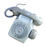 Grey vintage rotary dial phone with earpiece