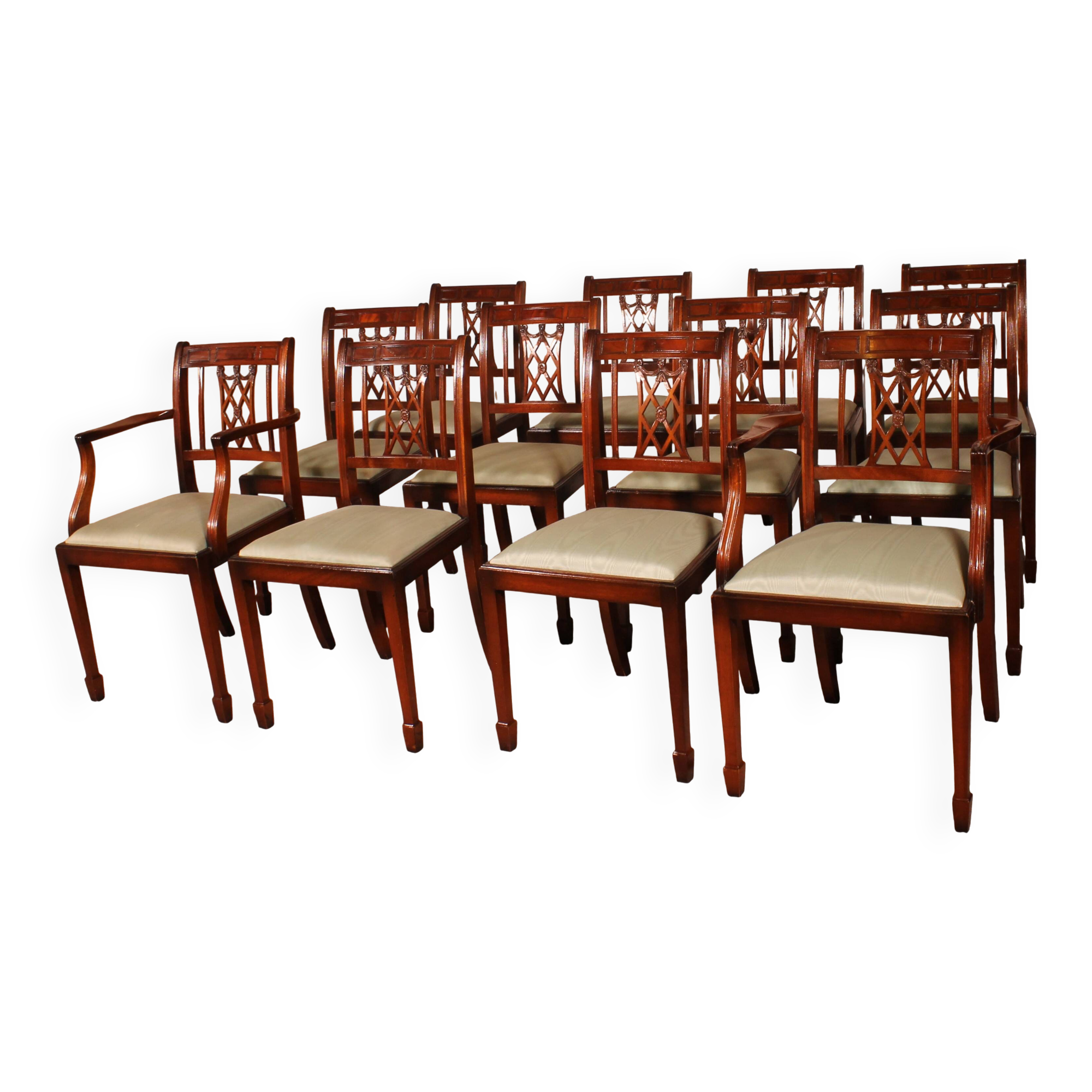 set of 10 chairs and two mahogany armchairs in Hepplewhite style
