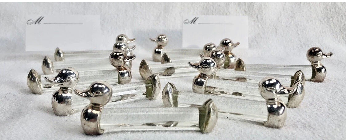 12 silver-plated metal duck knife rests with crystal.