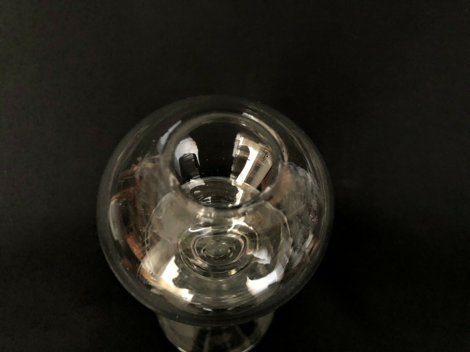 Glass oil lamp blows on foot shower