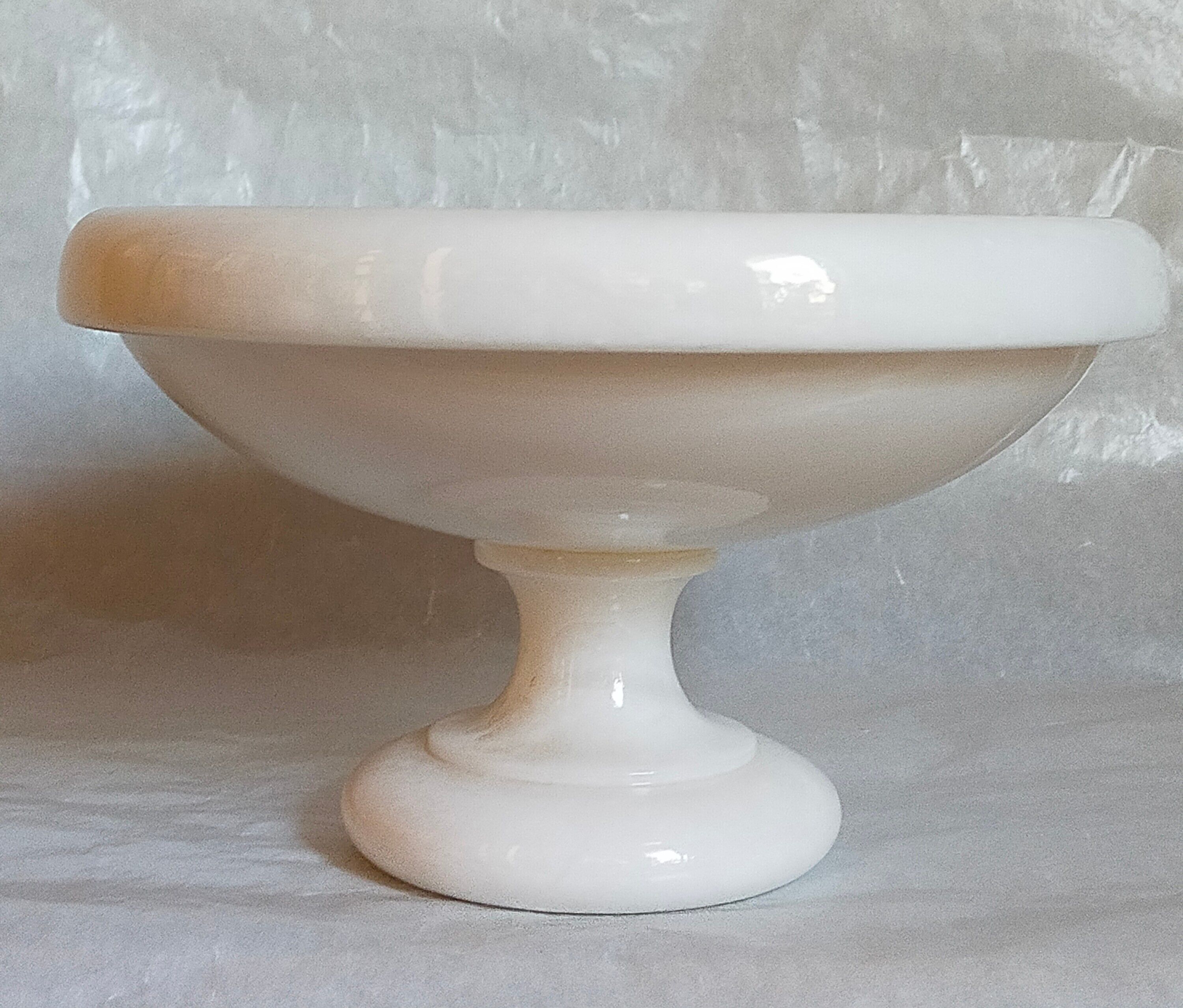 Standing cup in old white marble