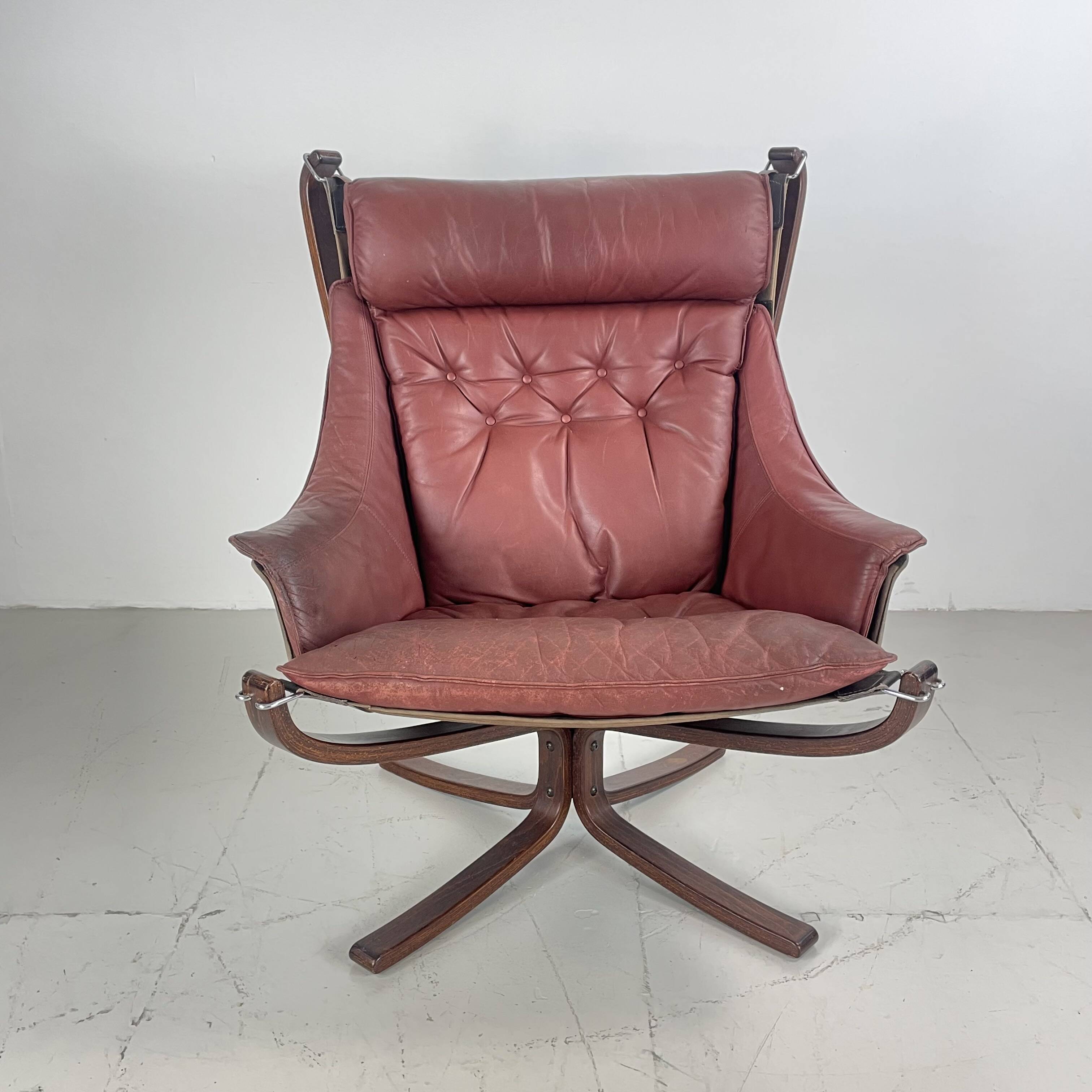 Vintage winged leather high backed Falcon chair designed by Sigurd Resell