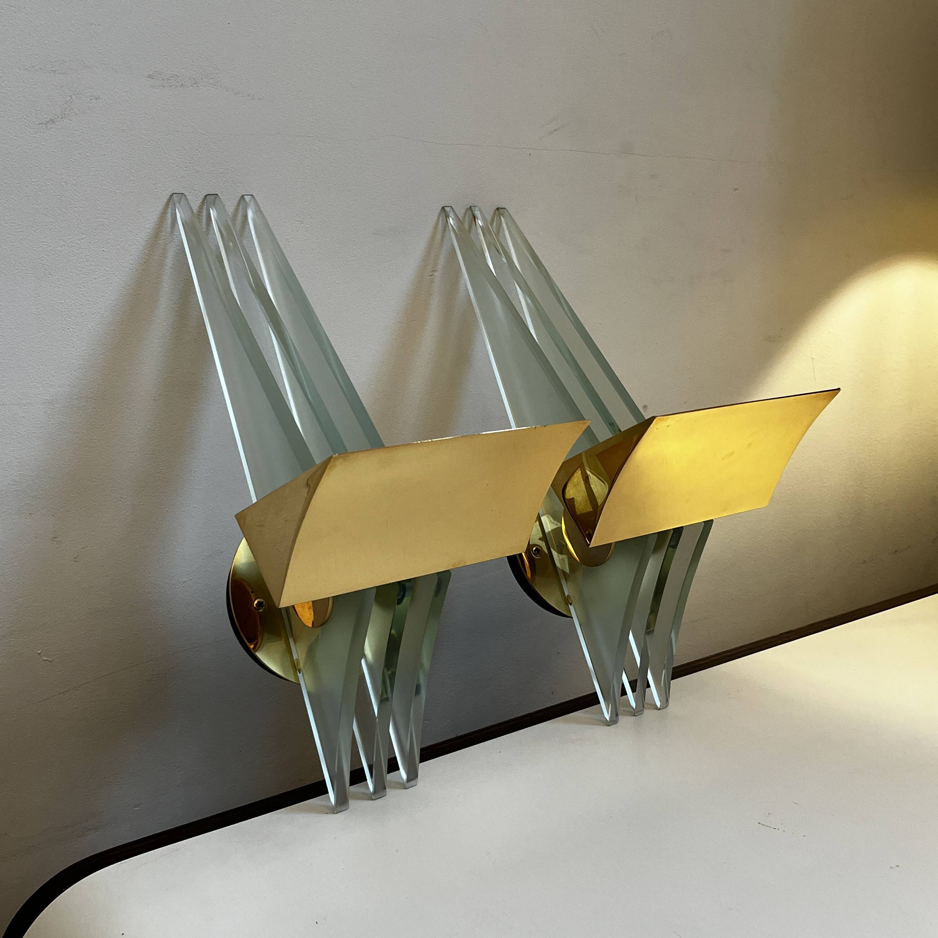 Pair of Hollywood Regency wall lights, bases & reflectors in gilded brass