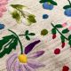 Cushion in hand-embroidered hemp.