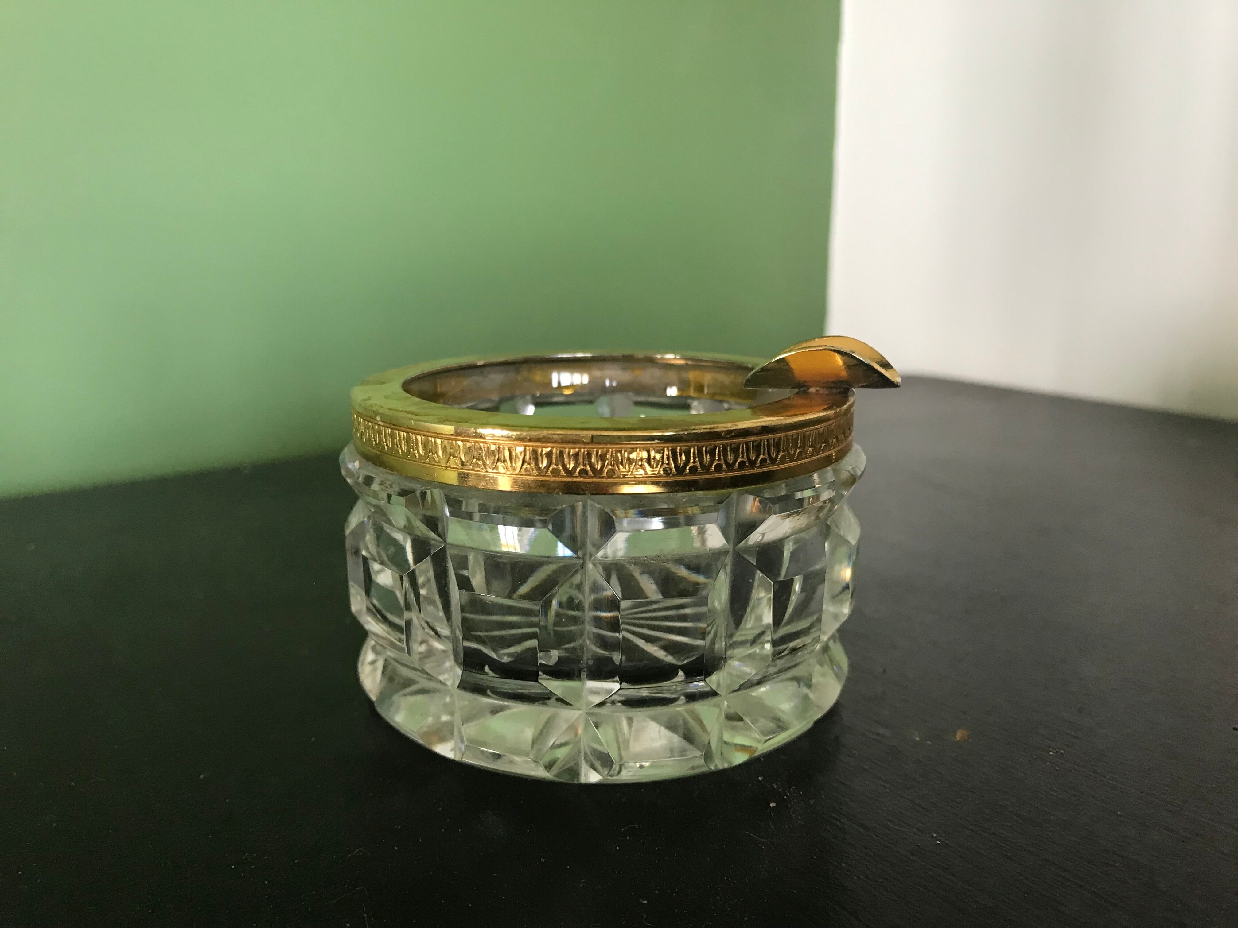 Glass ashtray and gold metal