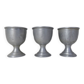 3 old aluminum shells
