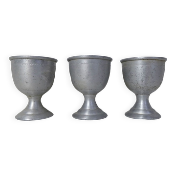 3 old aluminum shells