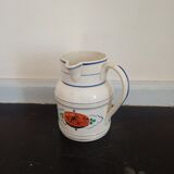 Old earthenware pourer with blue edging decoration