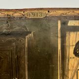 Sign read on cardboard illustrated with two Breton women in costume