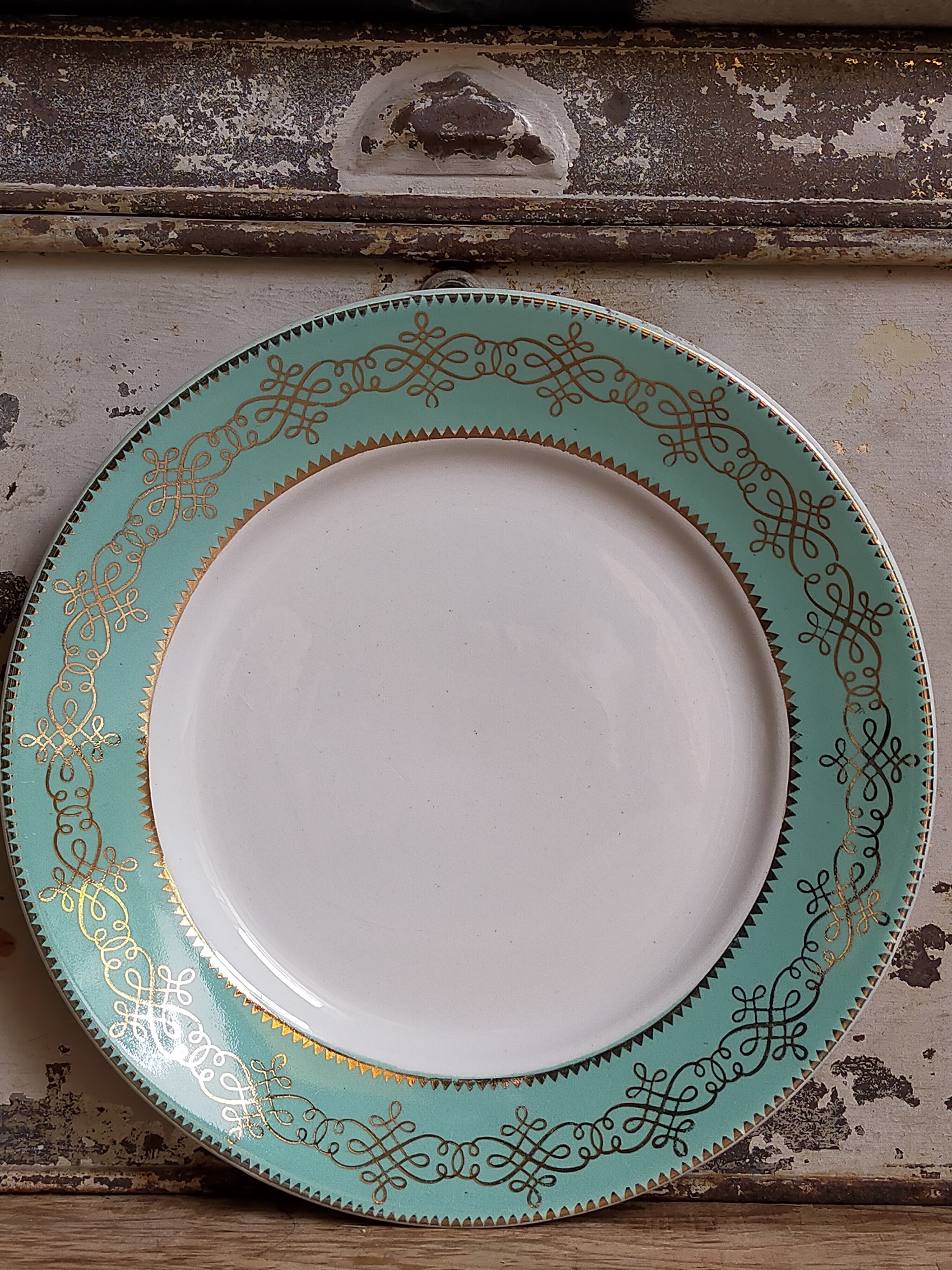 Six plates of vintage Badonviller earthenware with gold frieze