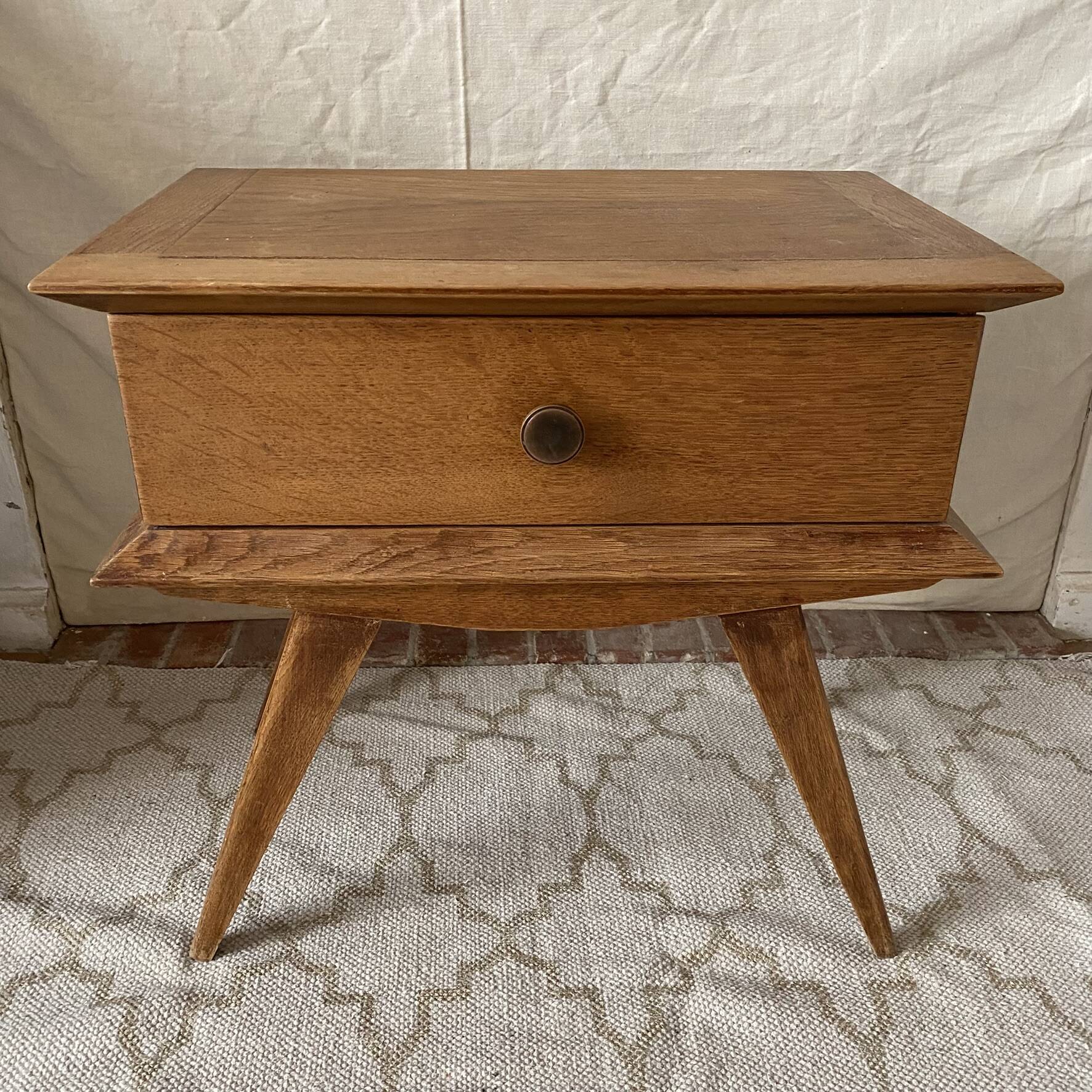 Scandinavian style bedside table with tapered legs from the 1960s.