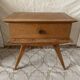 Scandinavian style bedside table with tapered legs from the 1960s.