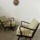 Set 2 old designer fireside chairs from the 50s wood and vintage fabric
