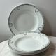 Set of 4 deep plates from Saint Amand with laurel wreath decoration.