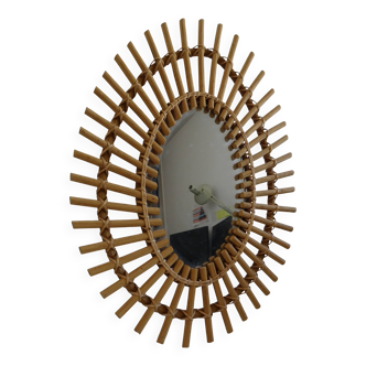 Vintage rattan oval sun mirror from the 60s/70s