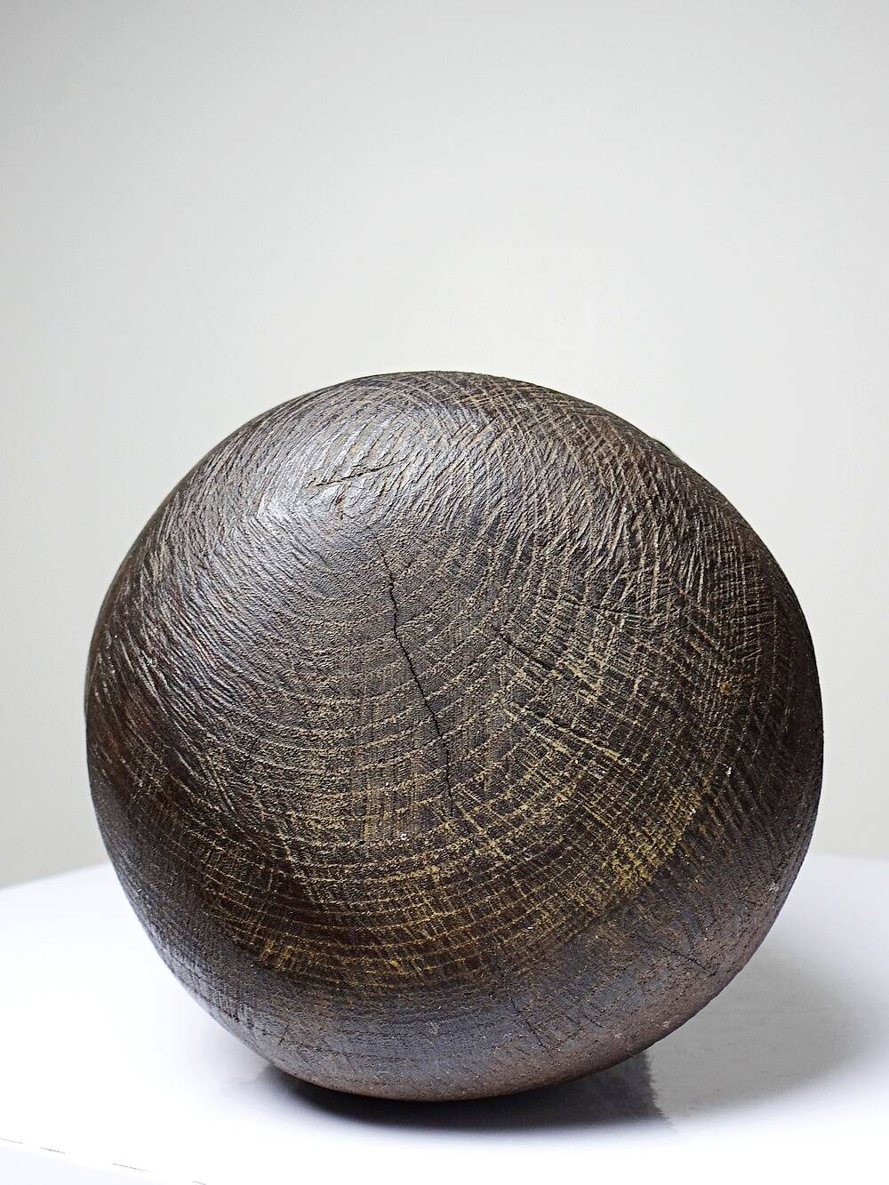 Monoxyle wood sculpture of a man's head, vintage craftsmanship from the 1950s.