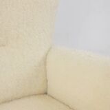 Armchair, or bergère, with its boucle fabric. 1950s