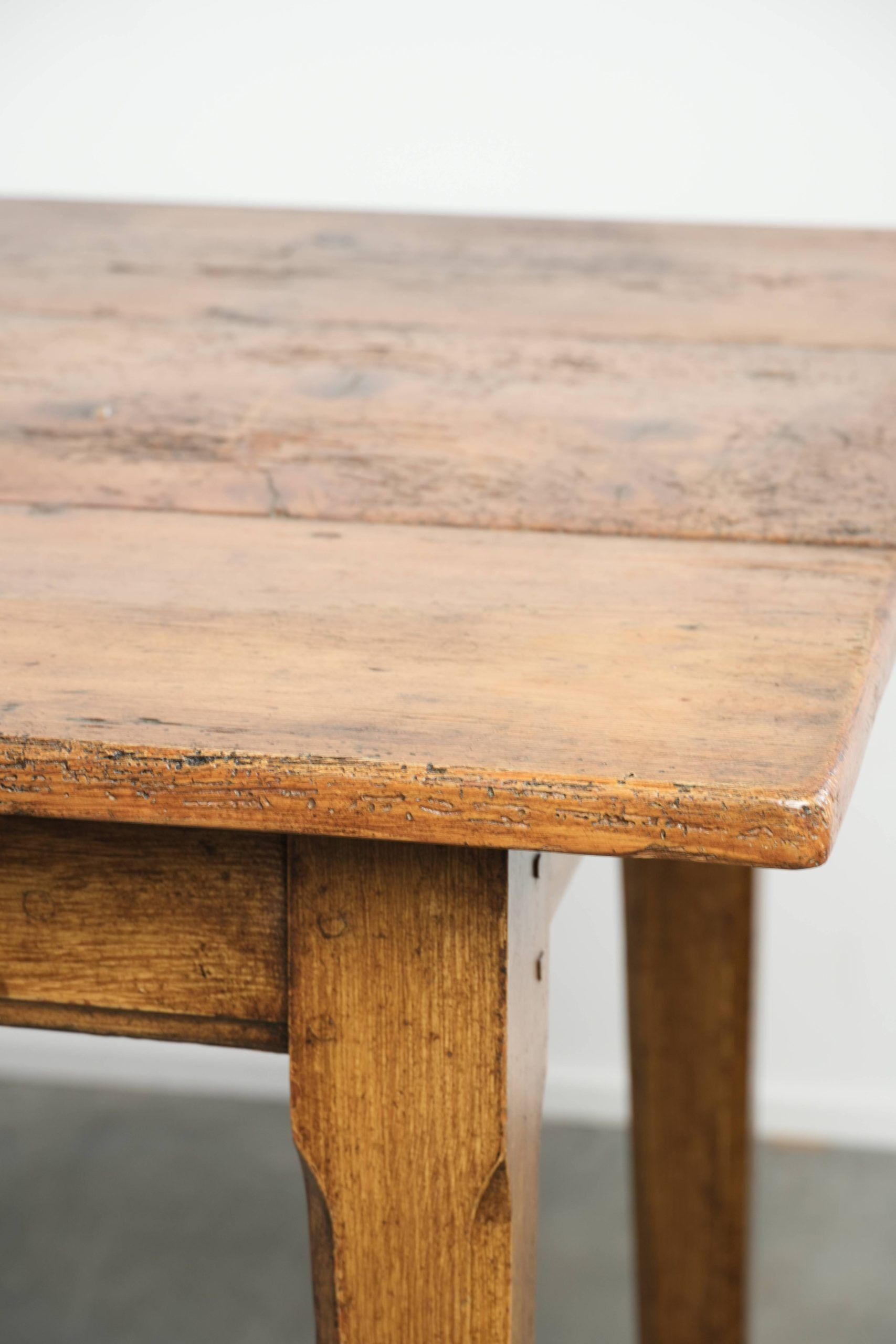 Antique French farmhouse dining table of pine wood from the 19th century