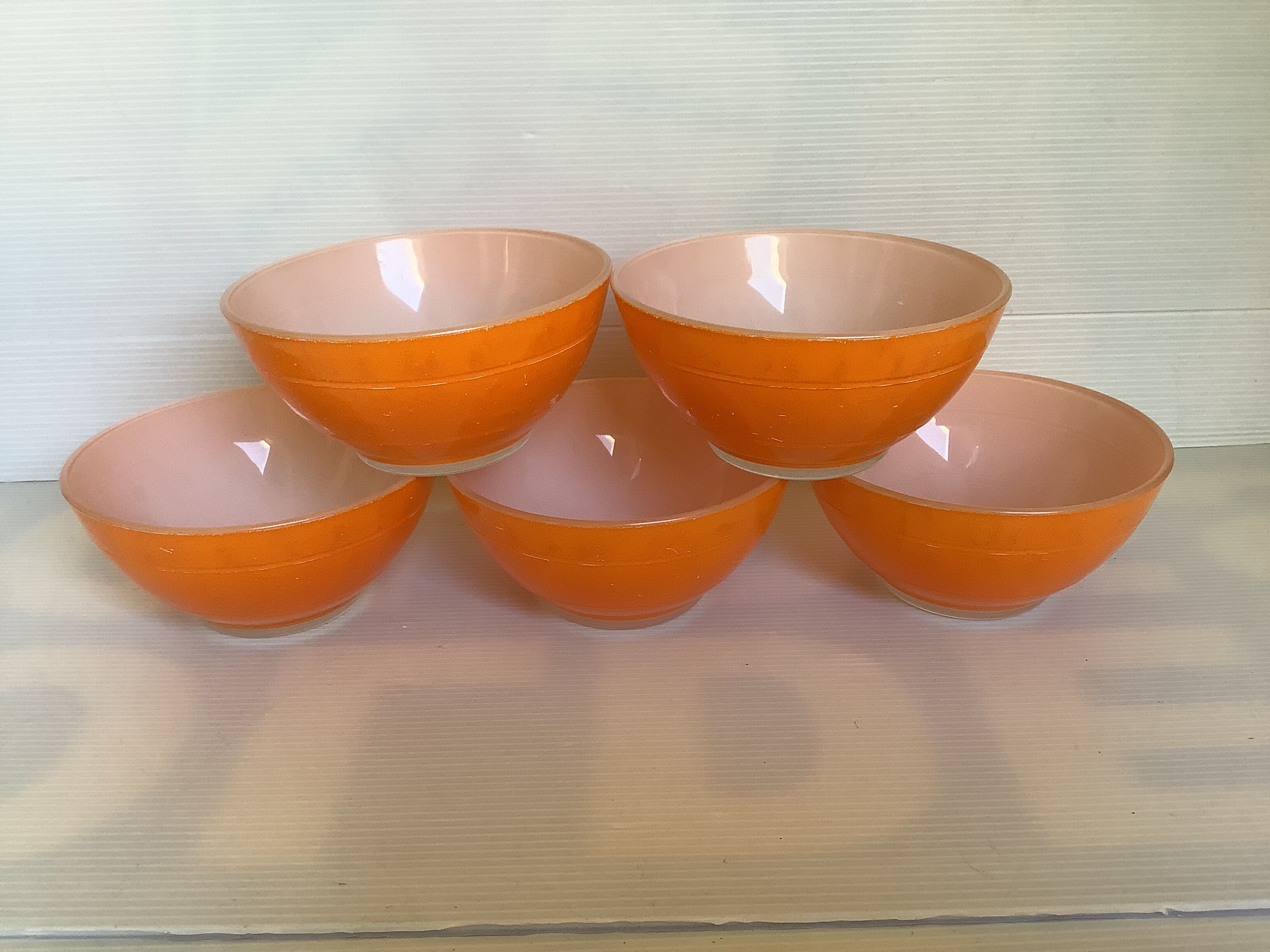 Five old orange duralex bowls