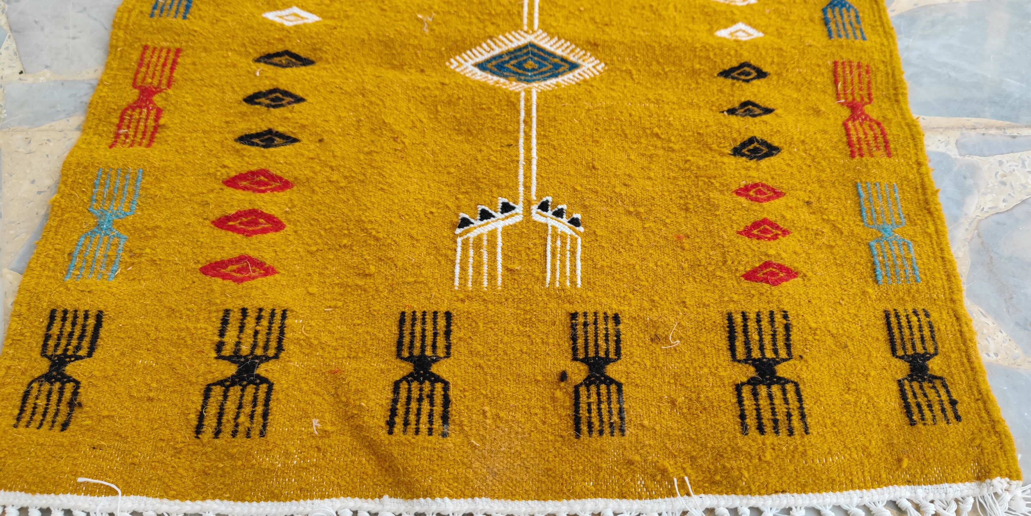 Mustard yellow kilim carpet with multicolored berber patterns