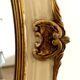 Miroir en bois et stuc a rehaut doré XX siècle