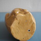 vintage earthenware vase with an old flower pick and an owl decoration