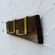 Vintage wooden and brass coat rack with 3 hooks from the 1960s.