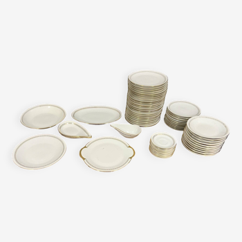 Vierzon porcelain: Important part of gilded service on a white background Art Deco period