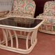 Lit Roche Bobois en rotin, fauteuils et table basse