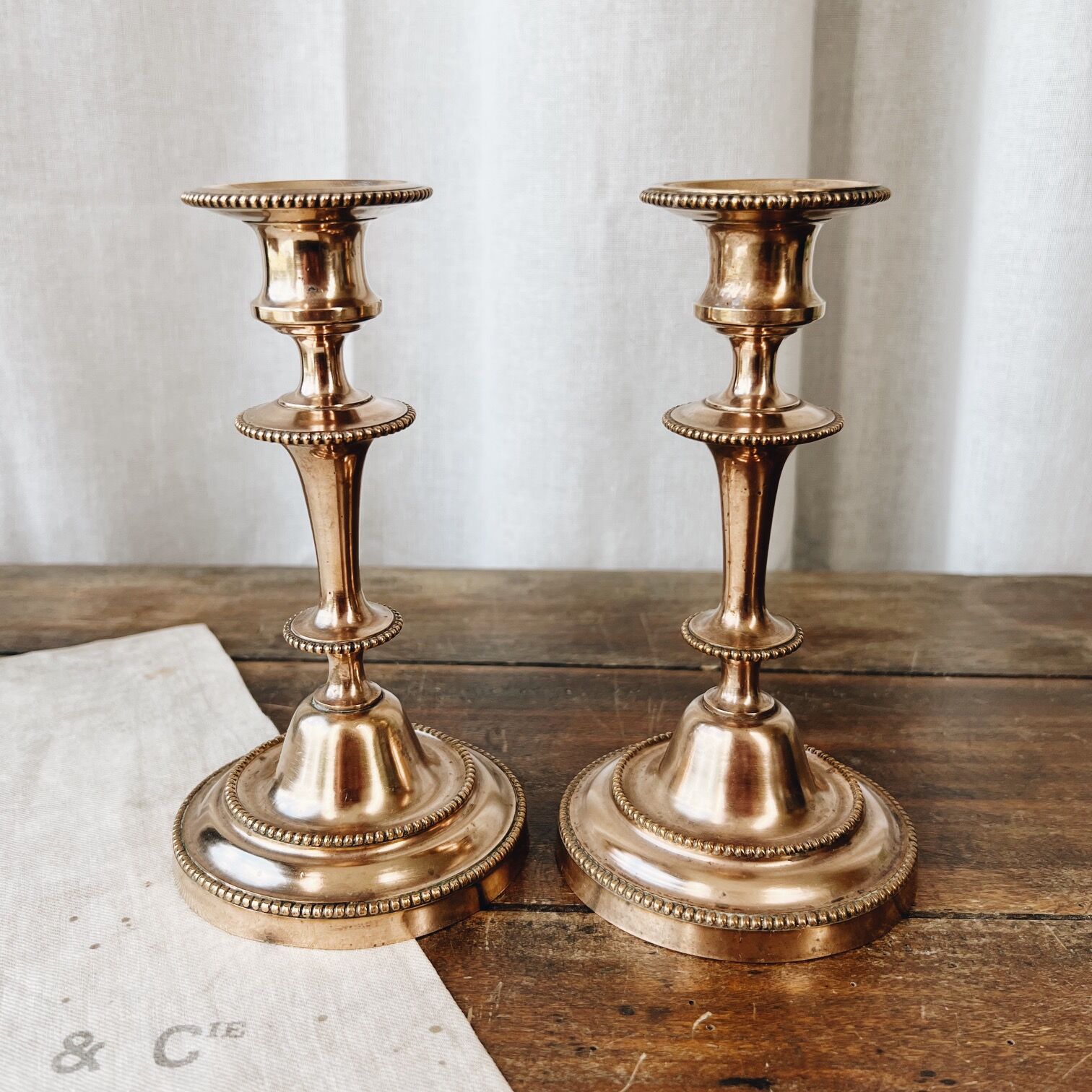 Duo of brass candle holders