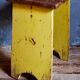 Art-populaire workshop stool in patinated wood