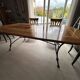 Extendable table in cherry wood with wrought iron legs.