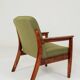 Fauteuil rétro en tissu boucle vert, forme ergonomique