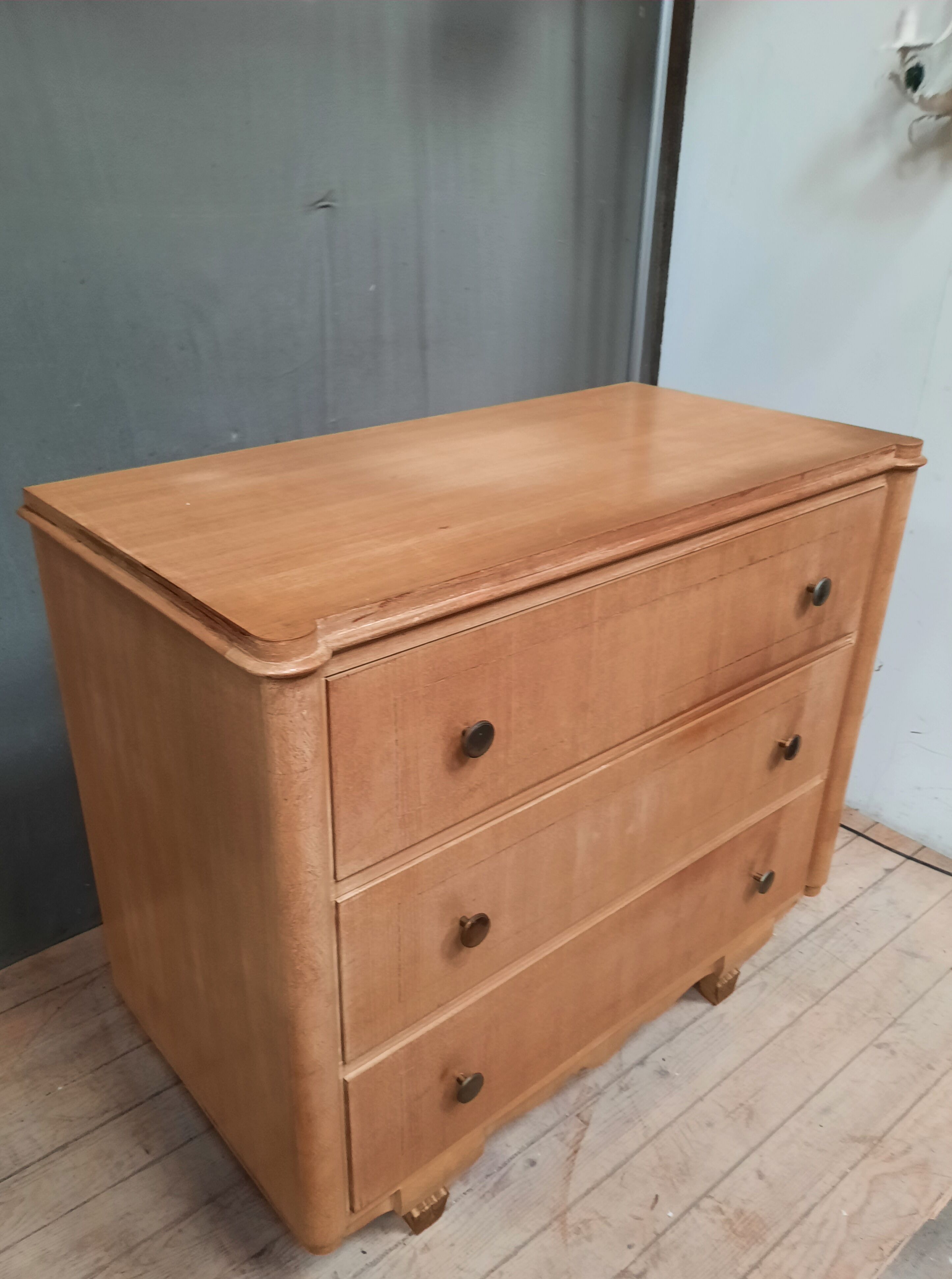 Vintage wooden chest of drawers with clear veneer