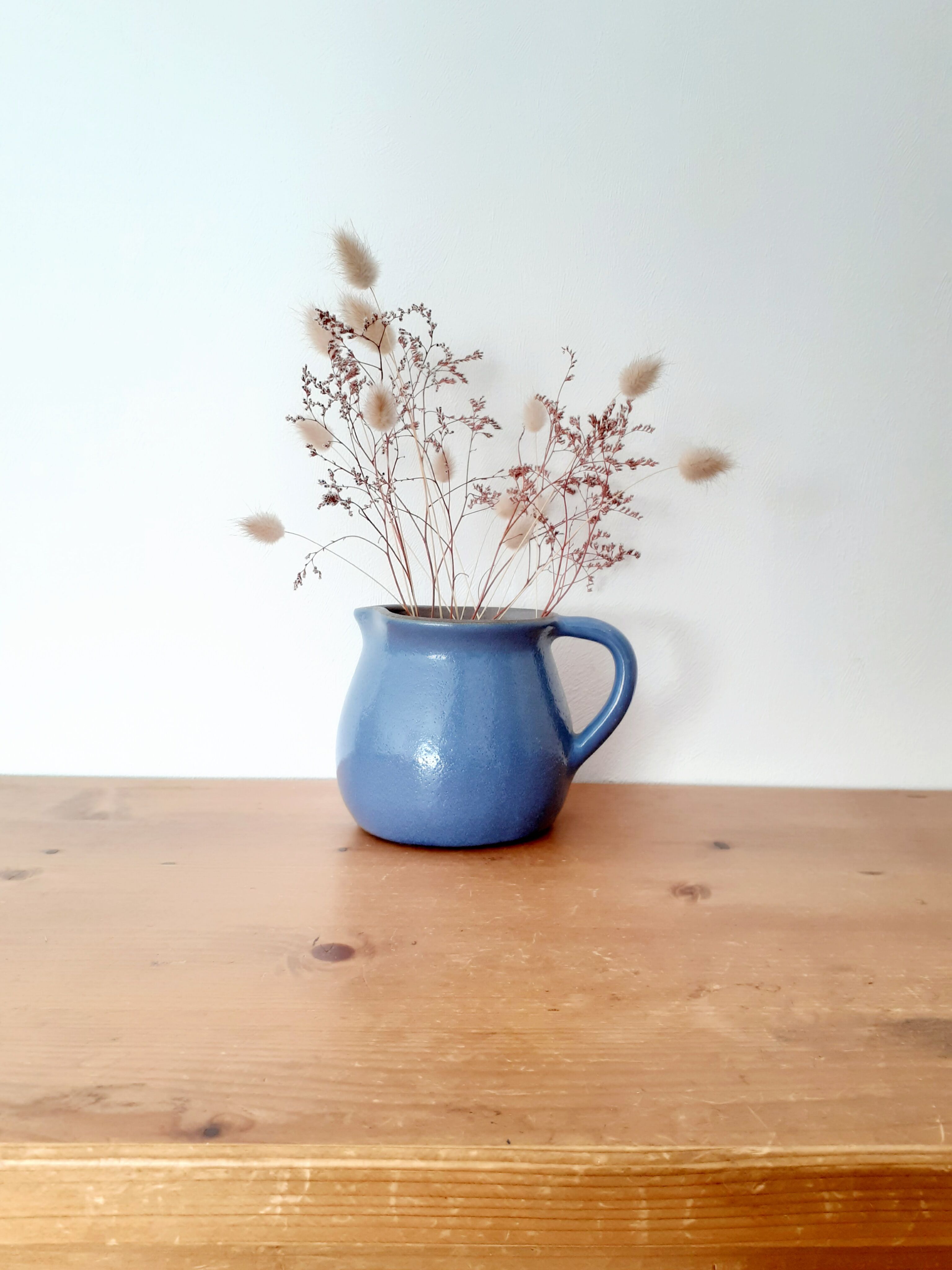 Old glazed blue sandstone pitcher