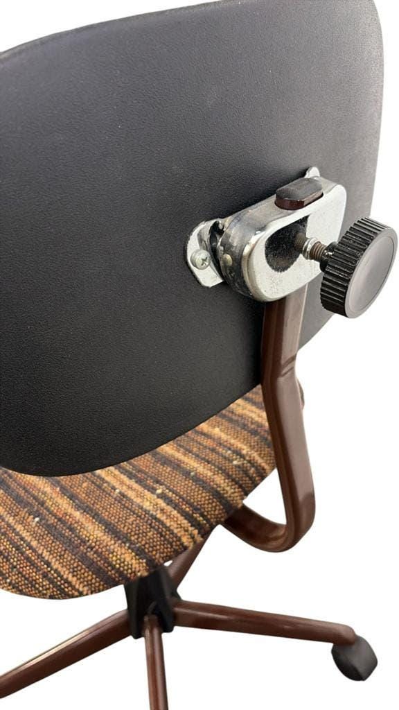 Brown vintage office chair from the 70s on wheels.