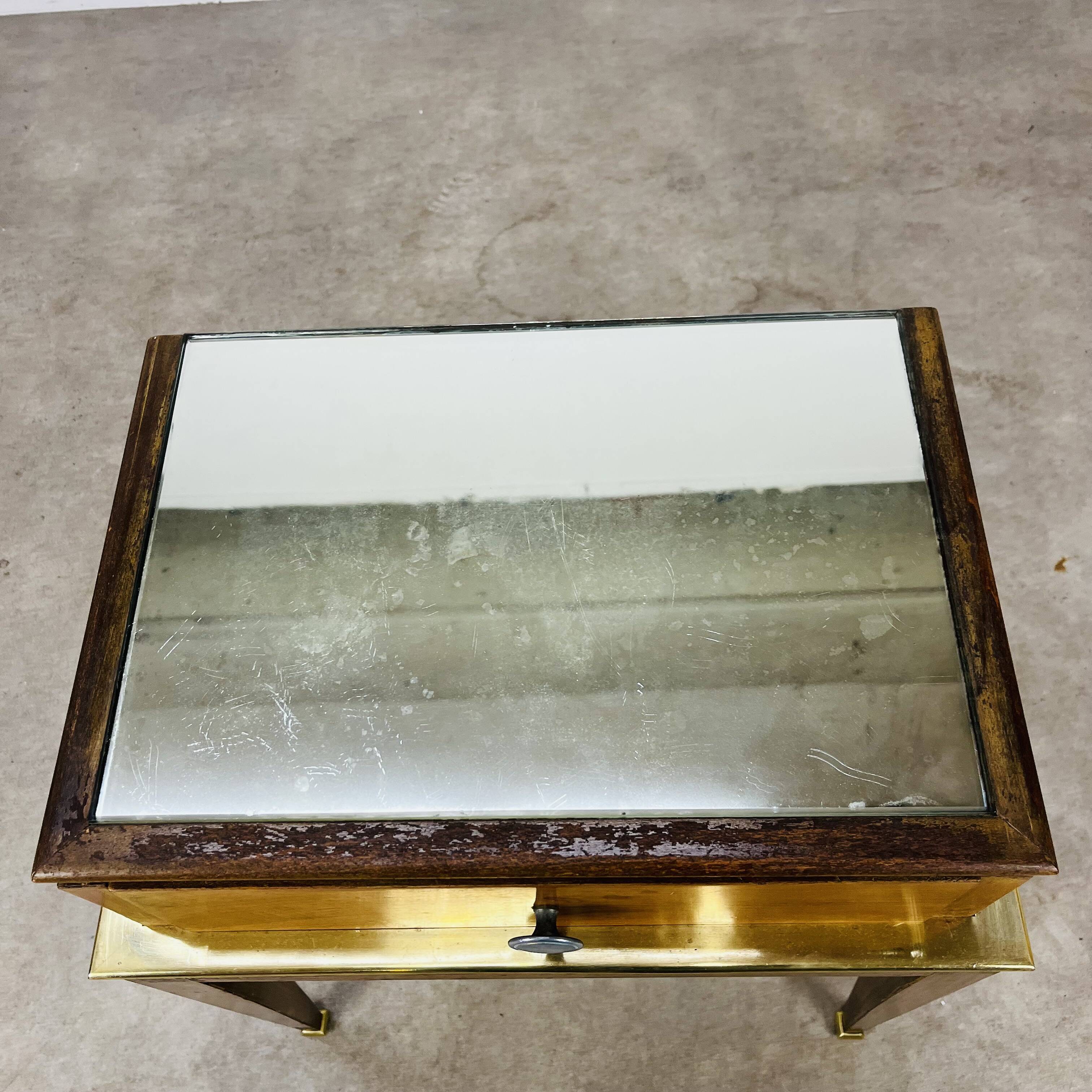 Art Deco mirror and brass bedside table