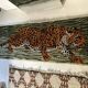 Vintage wool rug featuring a leopard (tiger)
