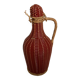 Small decorative bottle in burgundy wicker.