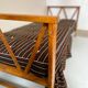 Two-seater bench convertible into a single bed.
