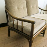 Two-seater rattan sofa with natural tones