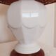 Ceramic lamp with rattan lampshade.