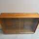 Vintage shop display cabinet with sliding doors