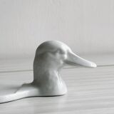 White porcelain dish in the shape of a duck.
