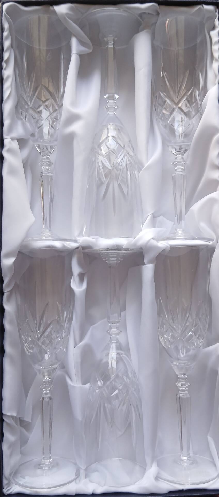 6 crystal champagne flutes from Lorraine Walsheid in their case.
