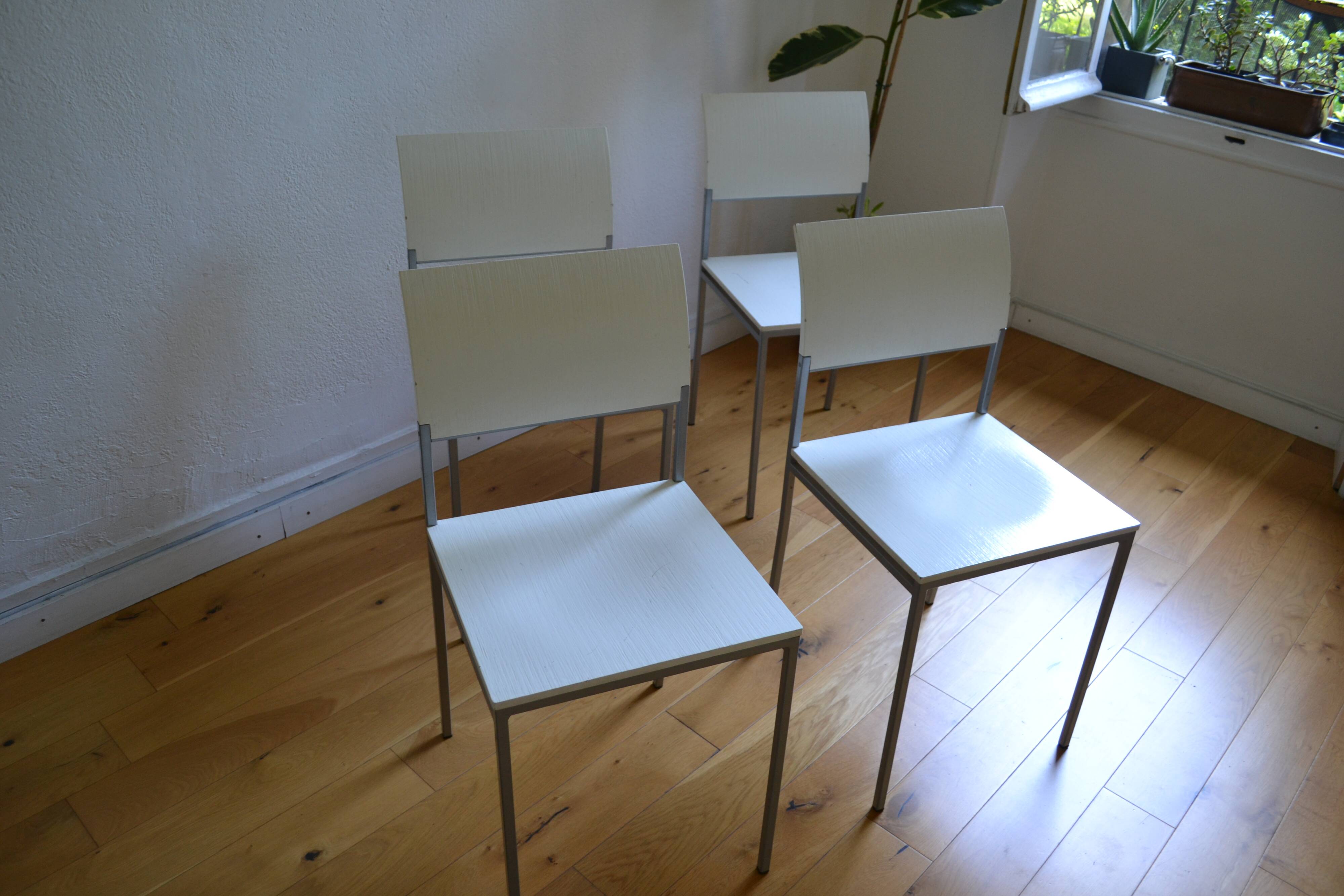 Set of 4 vintage metal and wood chairs from the 1990s.
