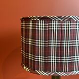 Lamp base in gilded brass, oval silk lampshade with a checkered pattern in burgundy.